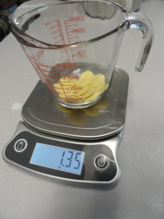Cocoa butter and oil being weighed on a food scale